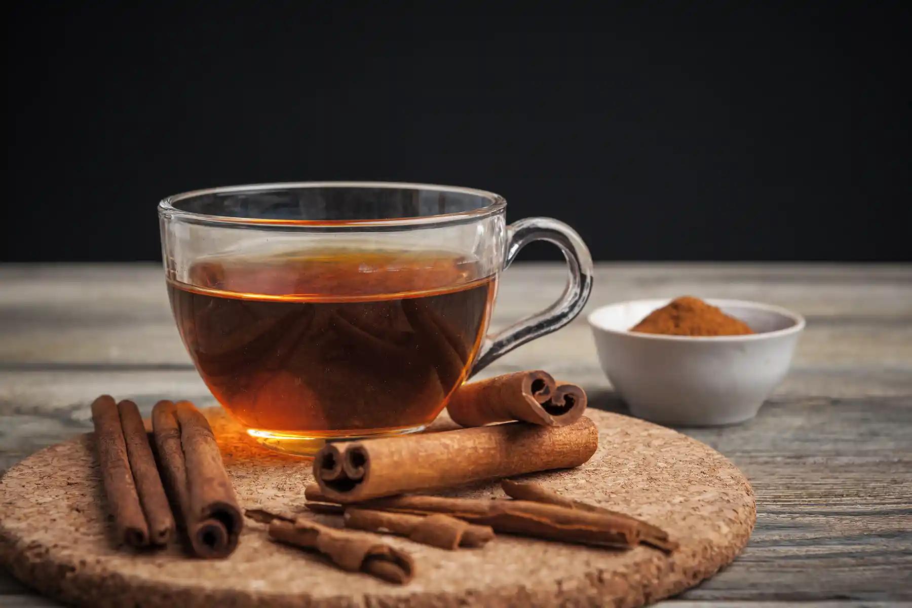 A warm cup of Ceylon cinnamon tea with cinnamon sticks and star anise.